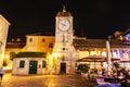 Trogir loggia, clock tower and tourist people in restaurant, Cro Royalty Free Stock Photo